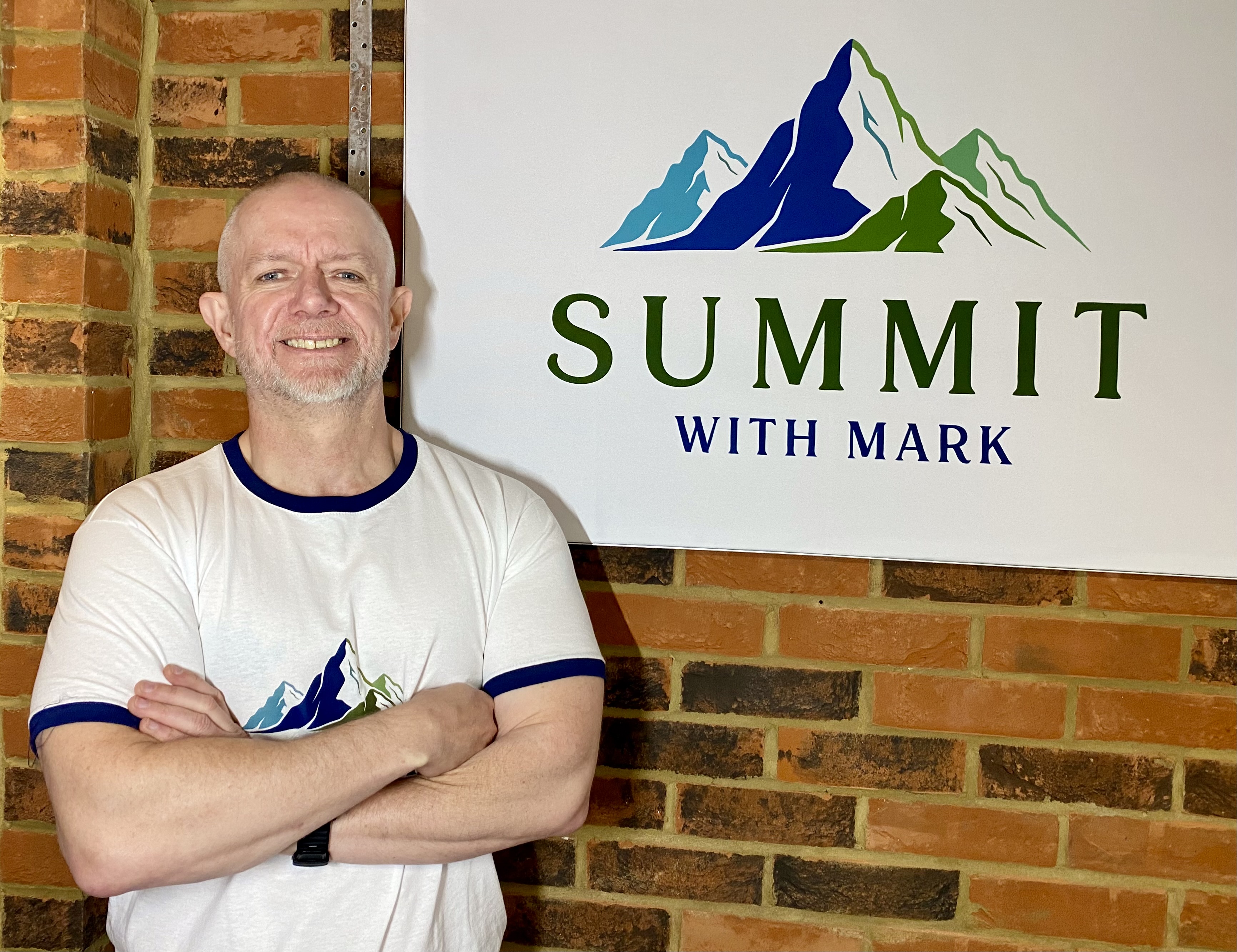 Mark standing confidently outdoors